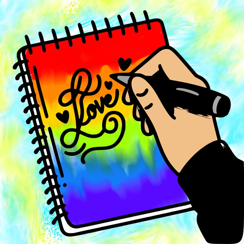 a hand writing “love” in calligraphy on a notebook