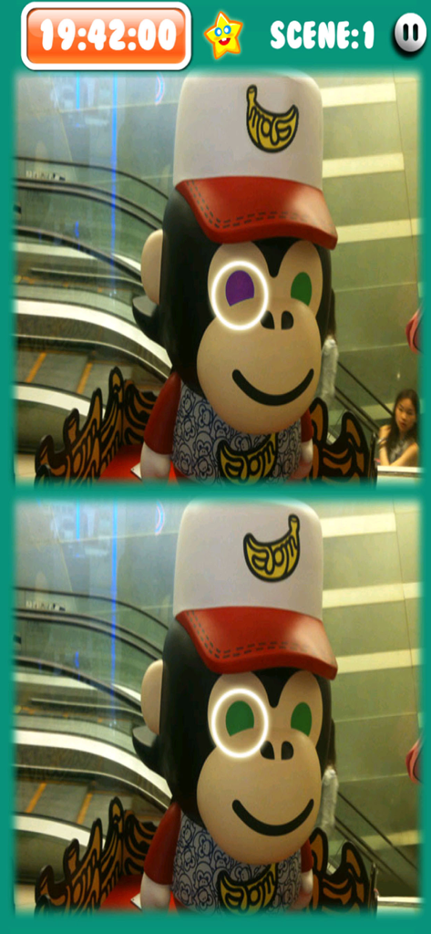 HK-PhotoHut - A spot the difference game screen from HK-PhotoHut featuring a monkey mascot statue in a Hong Kong shopping mall.