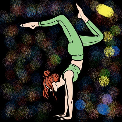 a woman doing a handstand