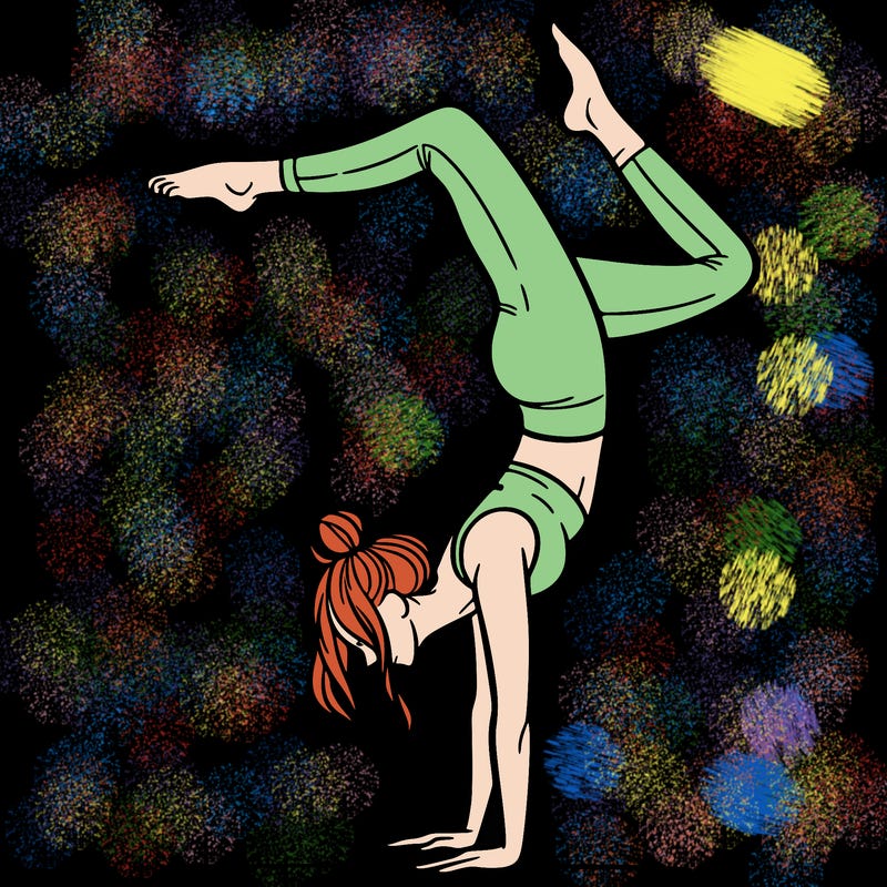 a woman doing a handstand