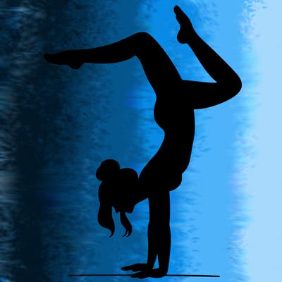 a woman doing a handstand