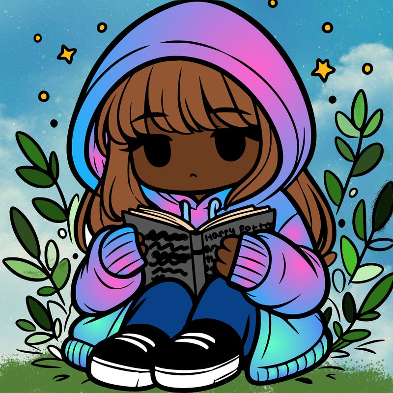 girl in oversized hoodie reading a book