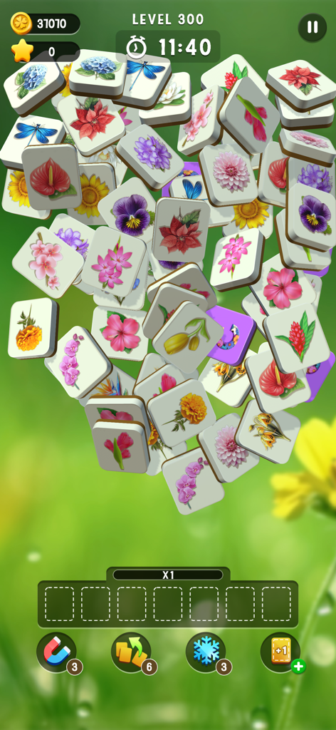 Blossom Match - A gameplay screen of Blossom Match featuring a stack of floral-themed tiles on a relaxing green background.