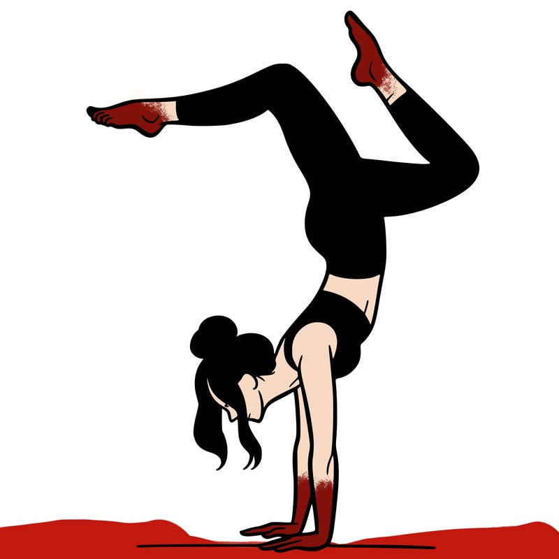 a woman doing a handstand