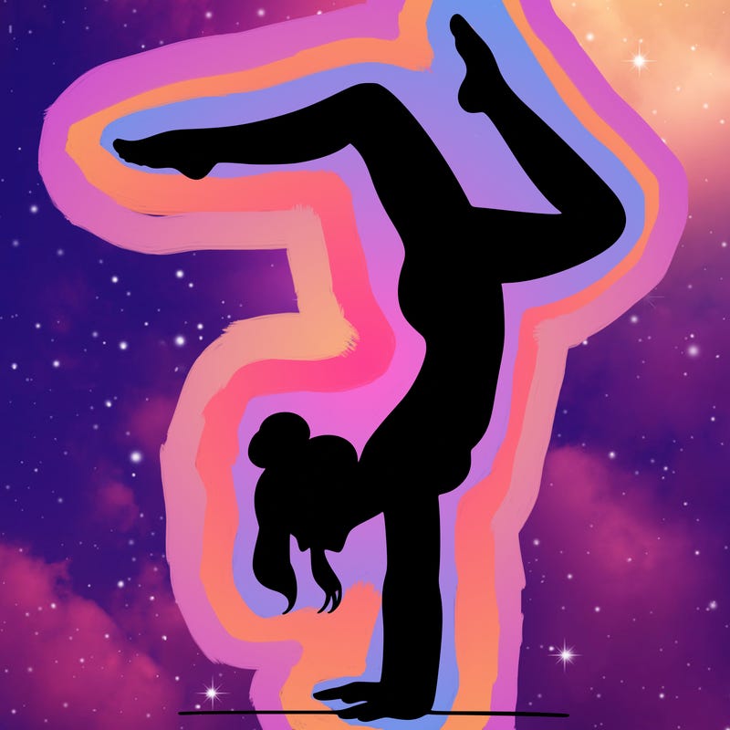 a woman doing a handstand