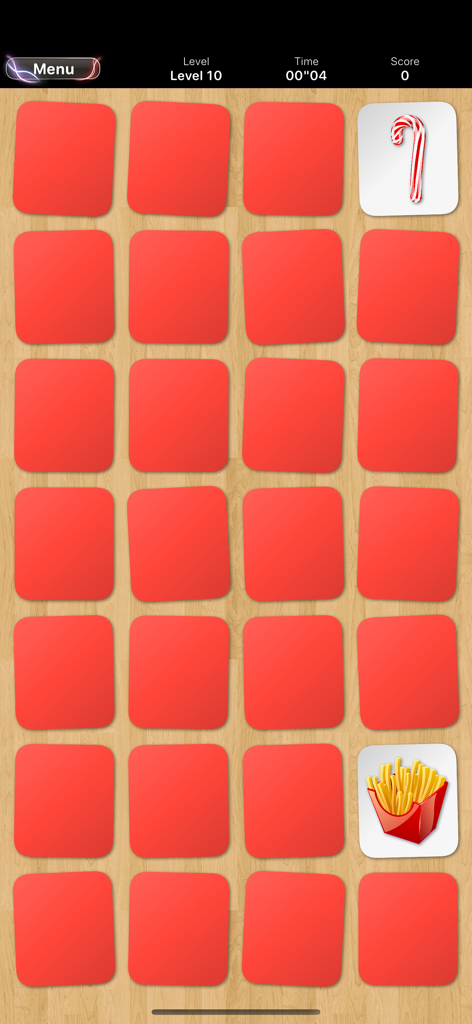 Memory • Platinium - Gameplay screenshot of Memory Platinium showing a grid of cards with food icons on a wooden background