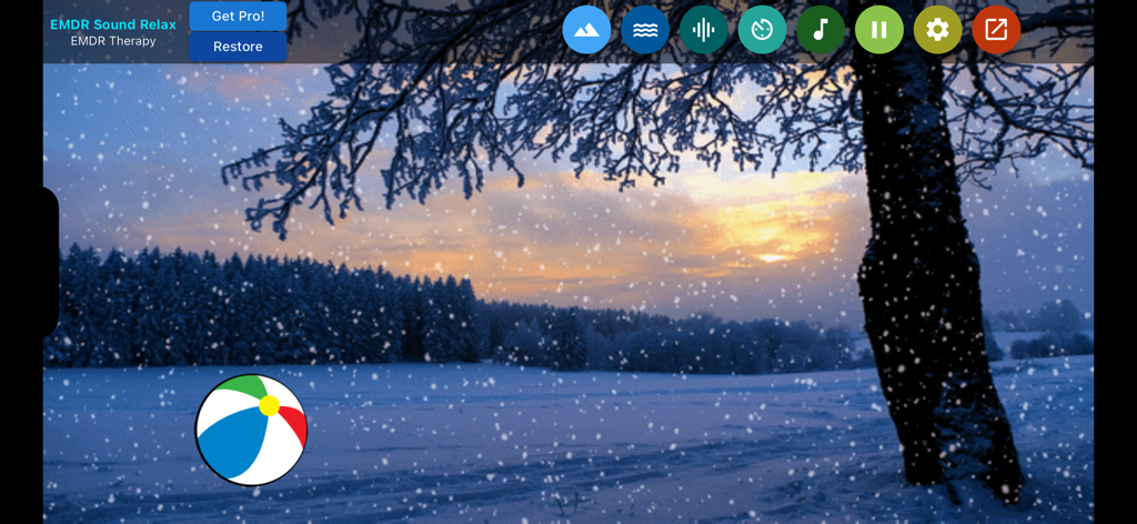 EMDR Sound Relax app screen showing a snowy winter landscape and a moving beach ball for bilateral stimulation therapy.