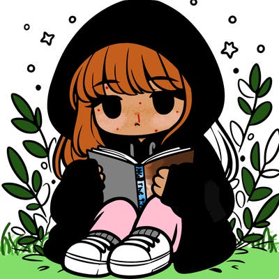 girl in oversized hoodie reading a book