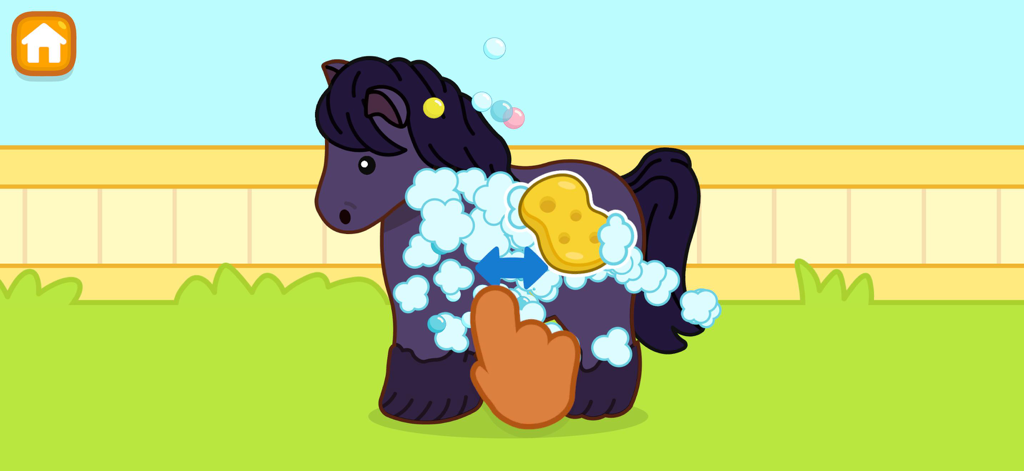 A cartoon purple pony being washed with soap suds and a sponge in the Fisher-Price Play and Learn app.