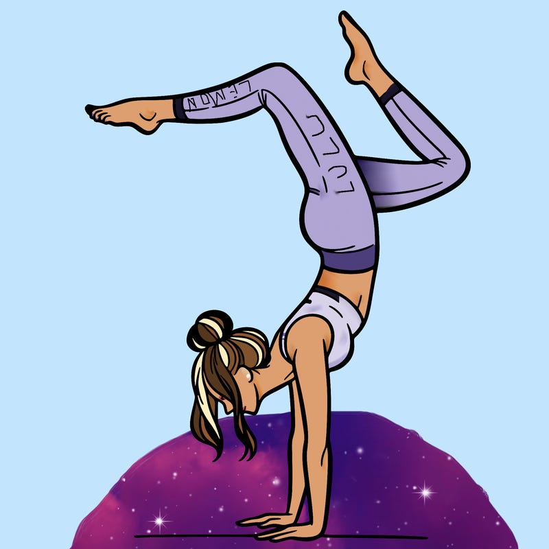 a woman doing a handstand