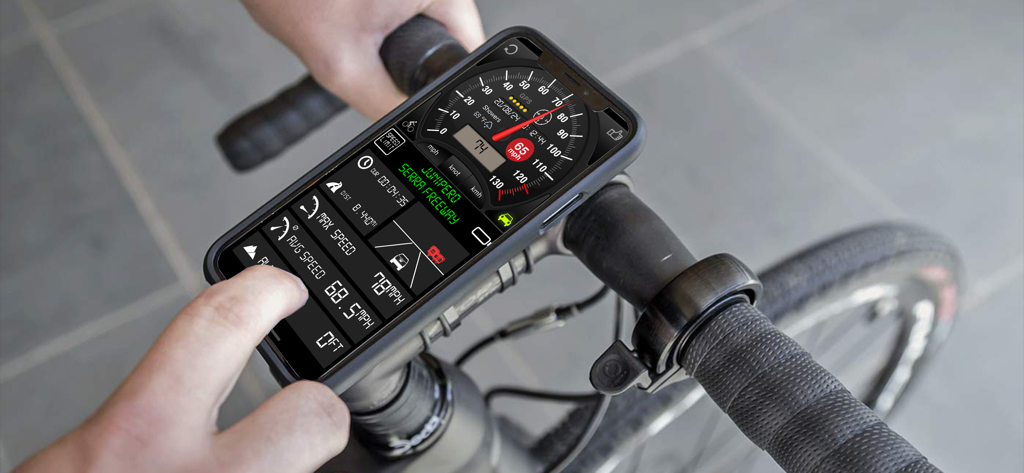 Speedometer ⊲ - iPhone montado en el manillar de una bicicleta mostrando la interfaz de la aplicación de velocímetro con datos de velocidad y navegación en tiempo real