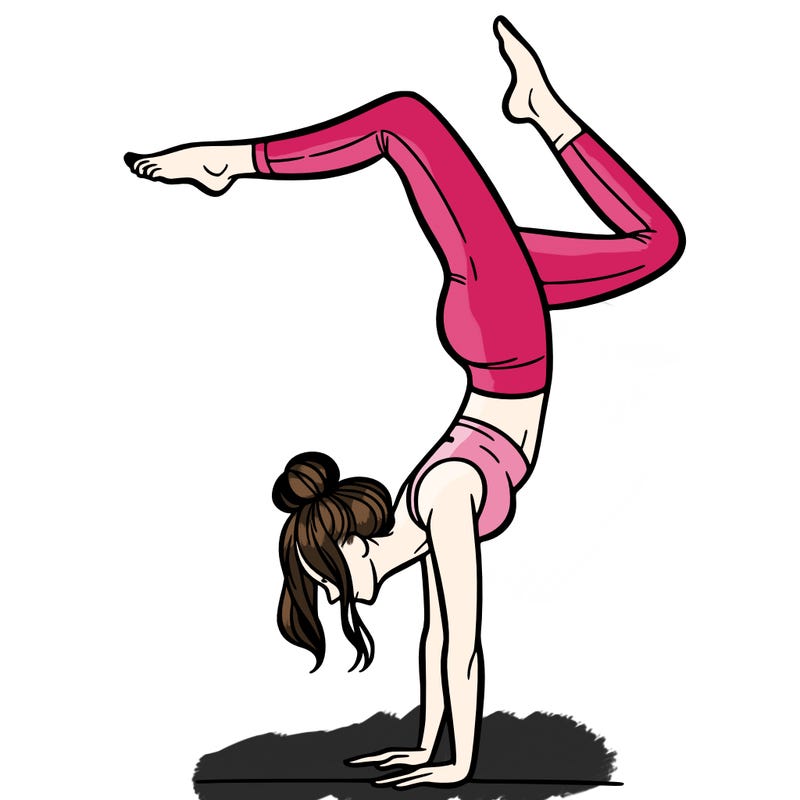 a woman doing a handstand