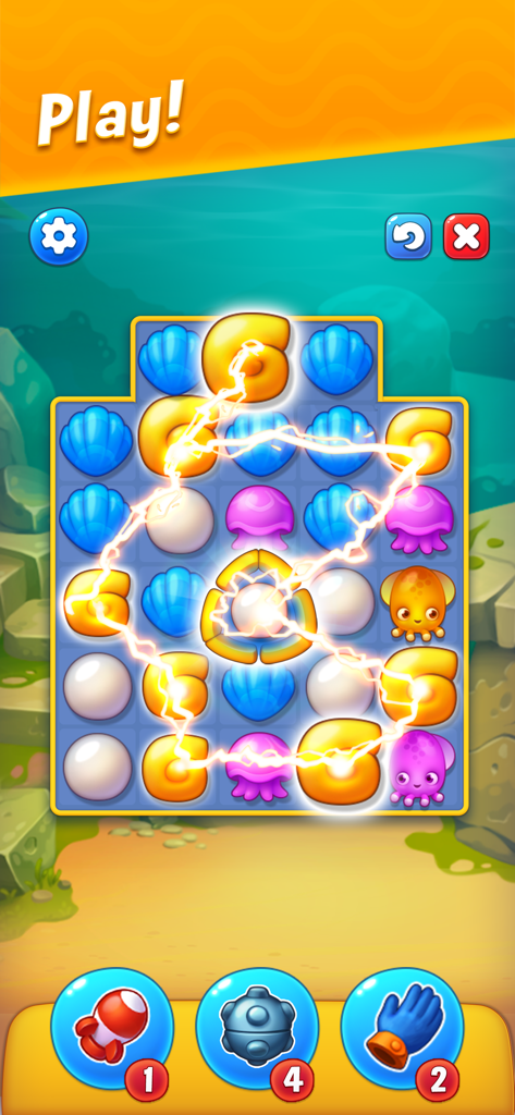 Fishdom - Jugabilidad de un puzle match-3 de Fishdom con coloridos íconos submarinos y potenciadores del juego