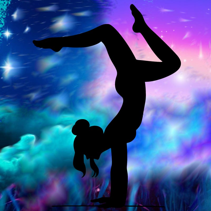 a woman doing a handstand