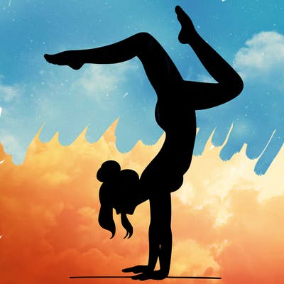 a woman doing a handstand