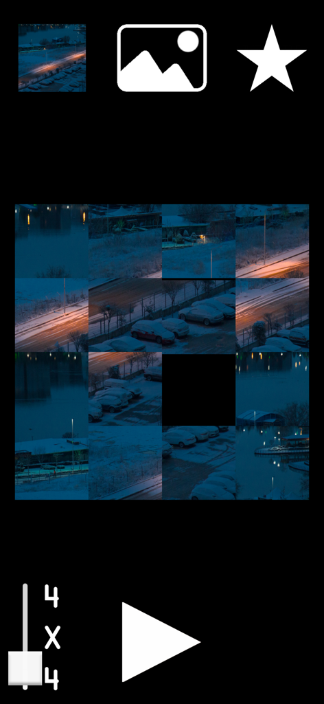 Image Mind Shuffle - A 4x4 scrambled sliding photo puzzle of a snowy city street at night