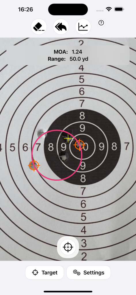 Una captura de pantalla de la aplicación MOA RangeR que muestra un valor de minuto de ángulo calculado de 1.24 para un agrupamiento de disparos en un objetivo de papel a 50 yardas.