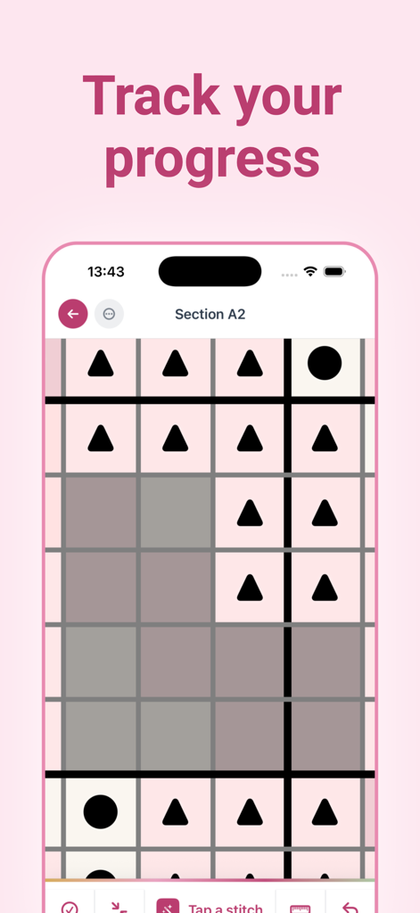 Uma grade digital de padrão de ponto cruz no aplicativo Stitch Fiddle mostrando símbolos e pontos concluídos para acompanhamento de progresso