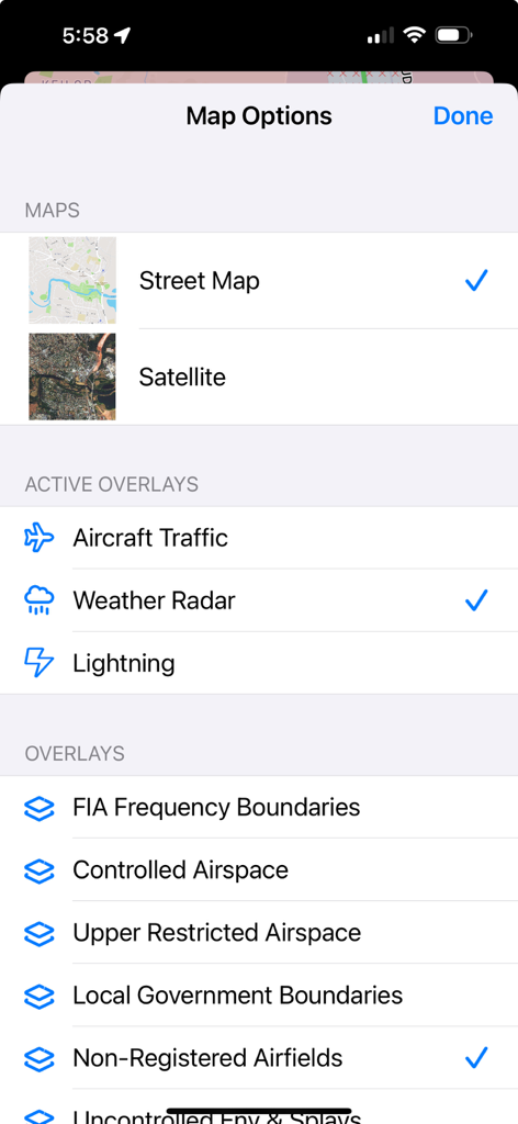 Map settings screen in the ok2fly app showing options for street maps satellite views and aviation overlays like weather radar and controlled airspace