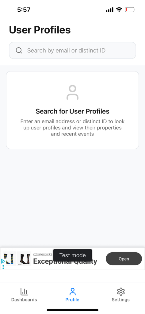 Mixpanel Mobile Analytics - User Profiles search screen in the Mixpanel Mobile Analytics app featuring a search bar for email or distinct ID.