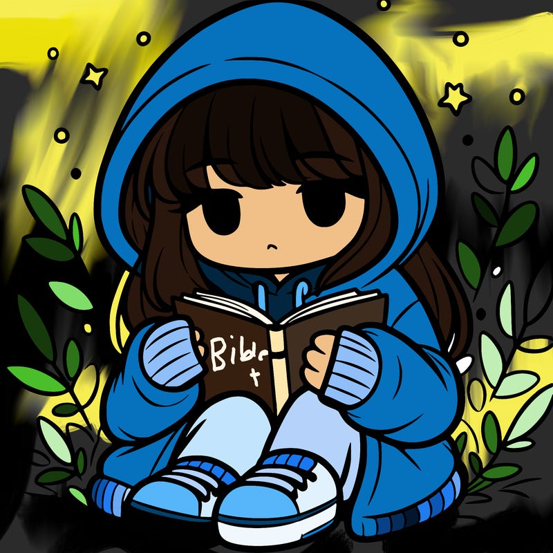 girl in oversized hoodie reading a book