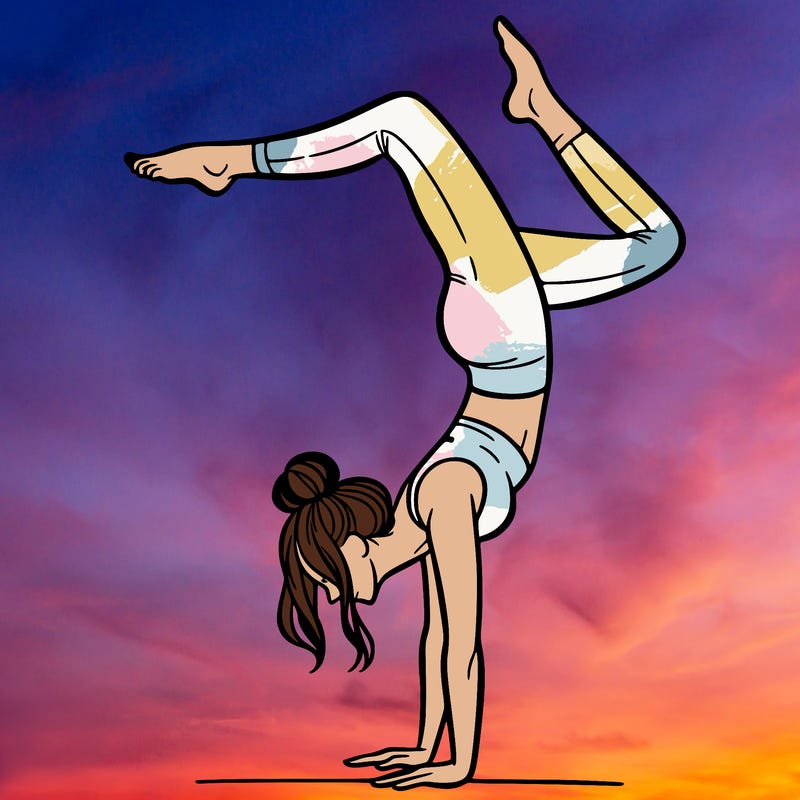 a woman doing a handstand