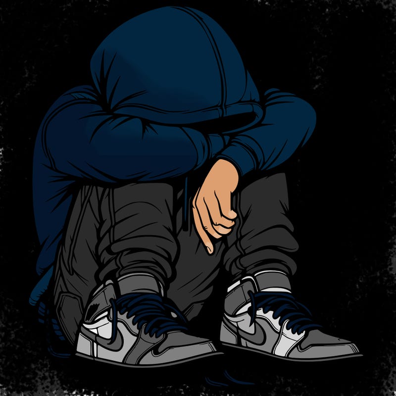 depressed man wearing hoodie and jordan shoes and baggy jeans