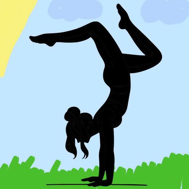 a woman doing a handstand