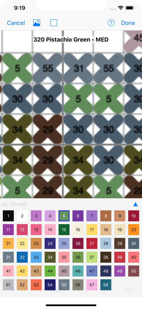 Stitched—Cross-stitch Patterns - A close up view of a digital cross stitch pattern editor showing a grid of numbered stitches and a color palette at the bottom