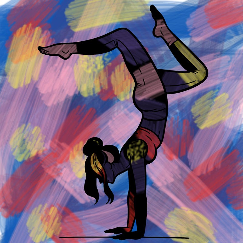 a woman doing a handstand