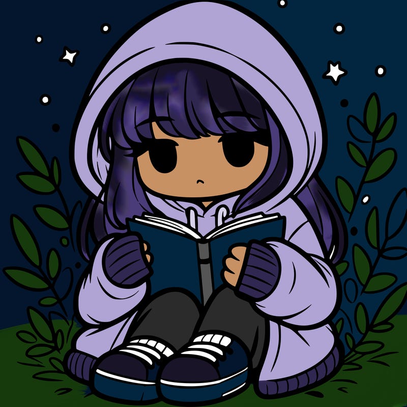 girl in oversized hoodie reading a book