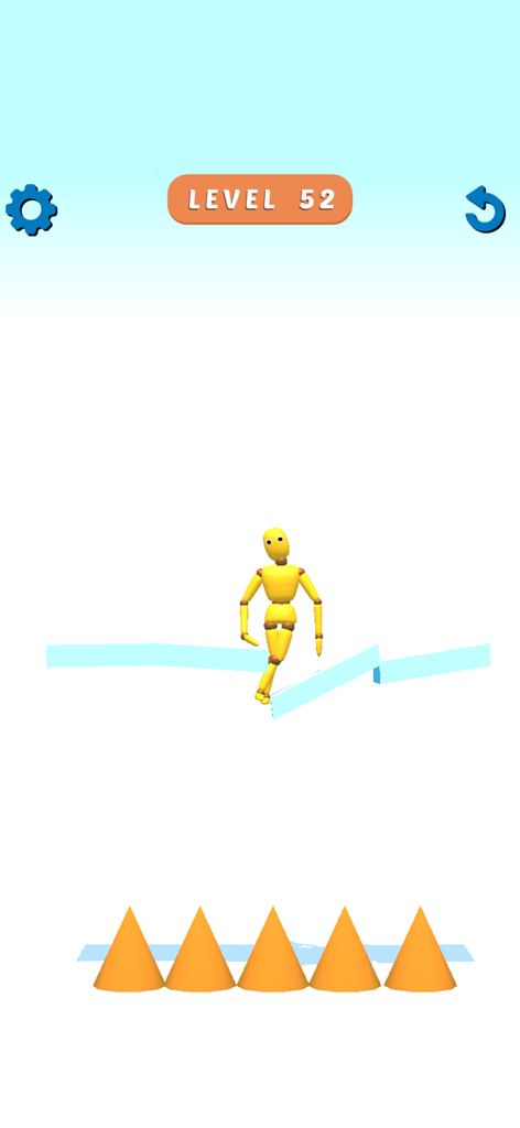 Ragdoll Games: Breaking Bones - Un muñeco de madera amarillo cayendo hacia púas naranjas en un juego de ragdoll basado en física.