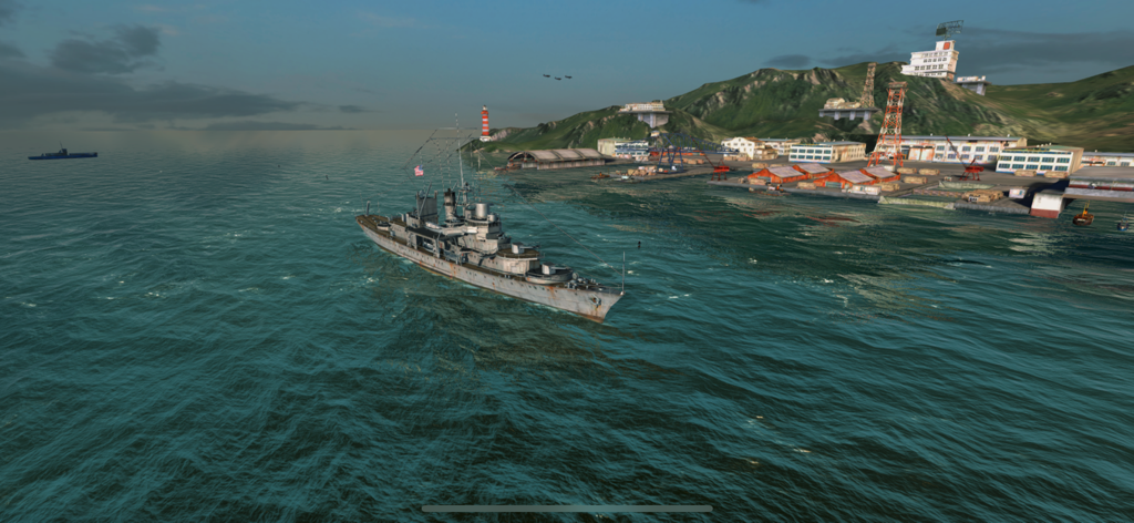 A 3D warship sailing near a coastal military port in World of Warships Blitz