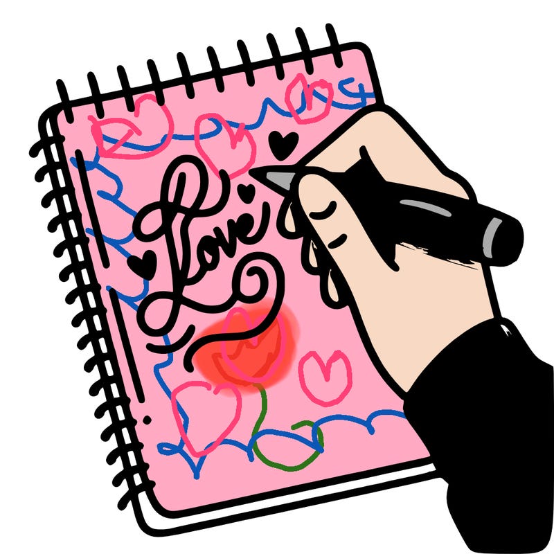 a hand writing “love” in calligraphy on a notebook