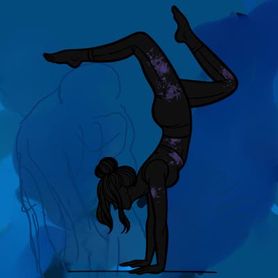 a woman doing a handstand