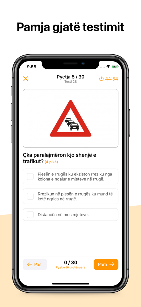 A mobile interface of a driving theory test question featuring a traffic sign in the Autoshkolla Kosove app