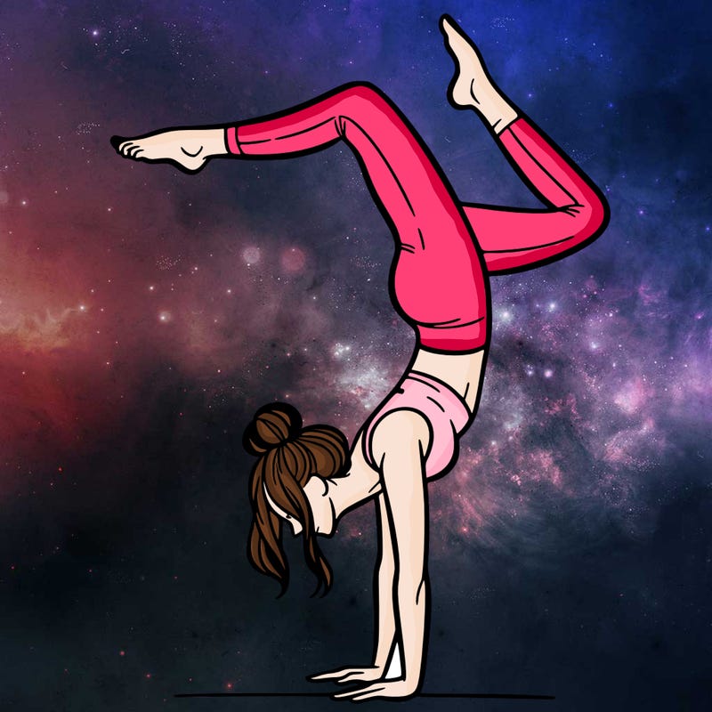 a woman doing a handstand