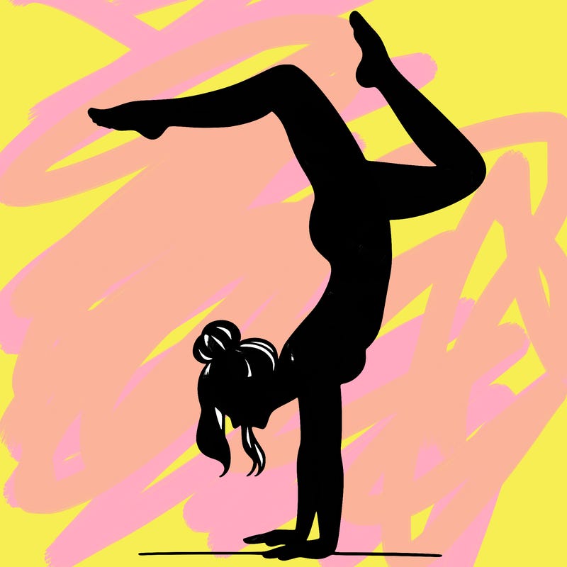 a woman doing a handstand
