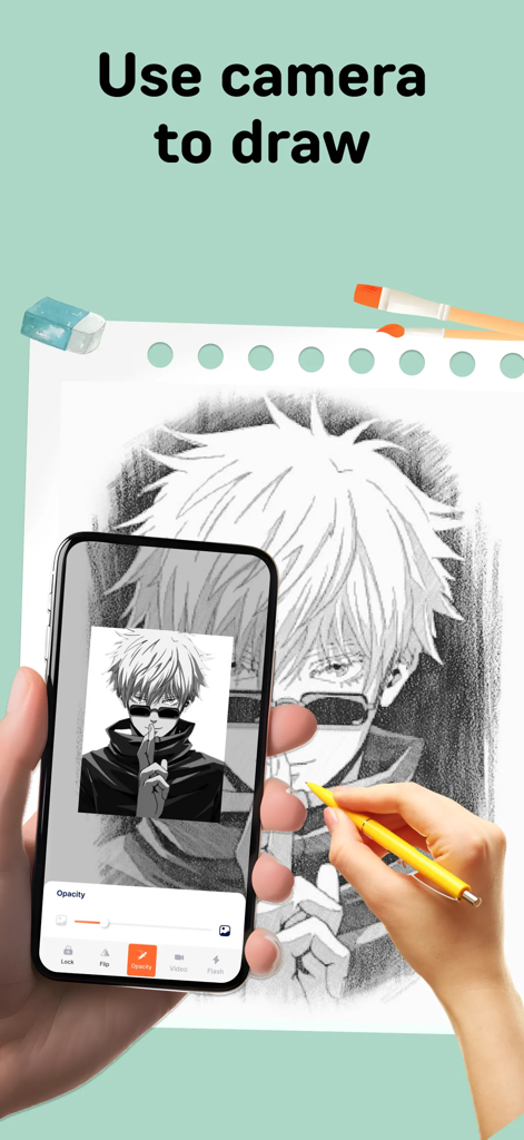 A person using the PicTrace app to trace an anime character onto paper using their phone camera and augmented reality.