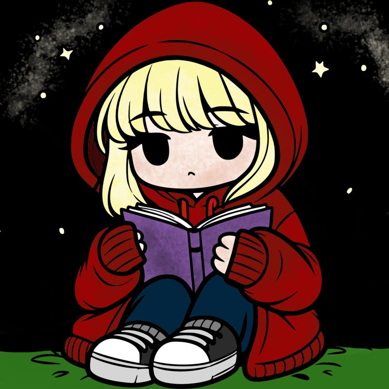 girl in oversized hoodie reading a book