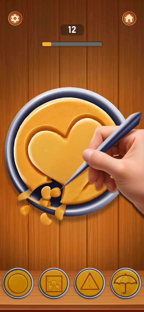 A hand carving a heart shape from a honeycomb candy in a mobile mini game