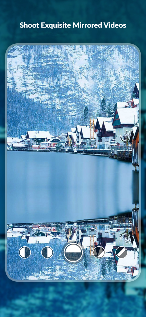 MirrorCam: Symmetry Maker - Screenshot of MirrorCam app showing a vertical mirror effect on a snowy lakeside village