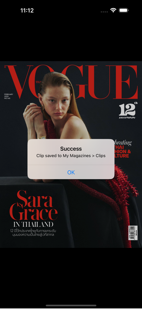 VOGUE Thailand - A success notification popup in the Vogue Thailand app for a saved magazine clip.