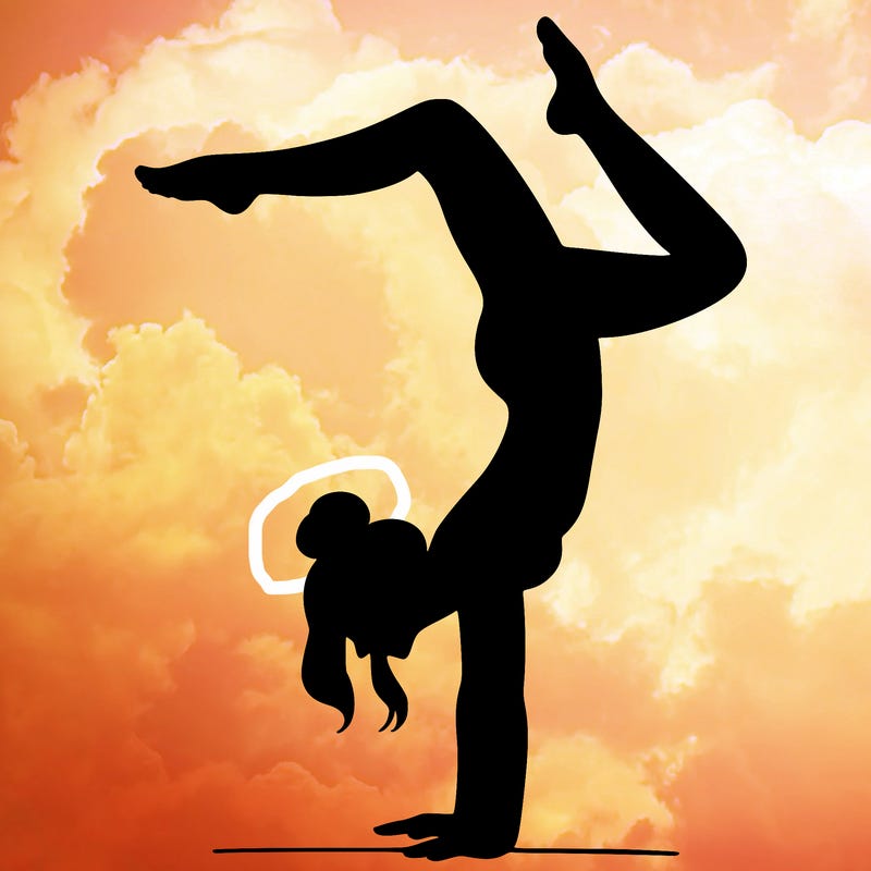 a woman doing a handstand