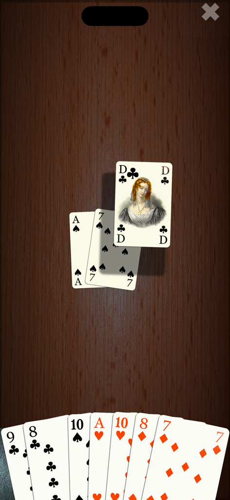 Jugabilidad de SkatGenius mostrando una mano de cartas y caras de cartas personalizadas sobre un fondo de madera