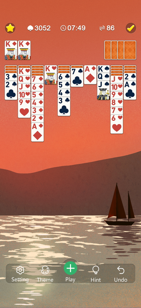 Classic Spider Solitaire Mania - Gameplay de Classic Spider Solitaire présentant de grandes cartes faciles à lire et un thème de coucher de soleil paisible