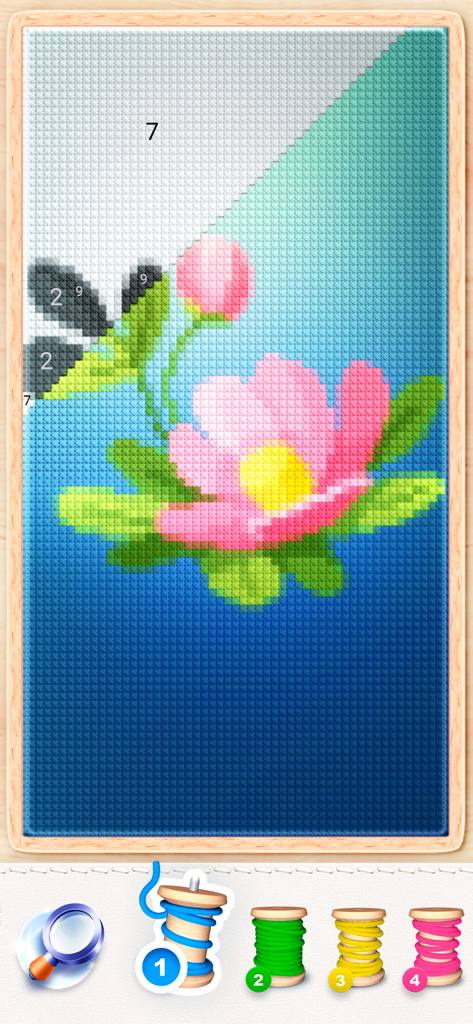 Gameplay of Magic Cross-Stitch app showing a pink flower being stitched by numbers.