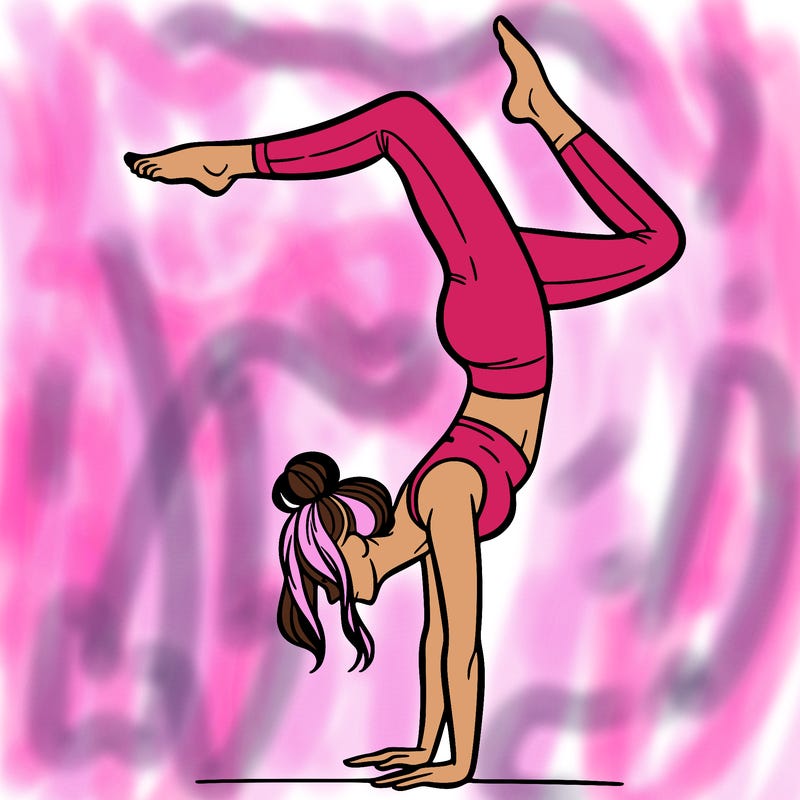 a woman doing a handstand
