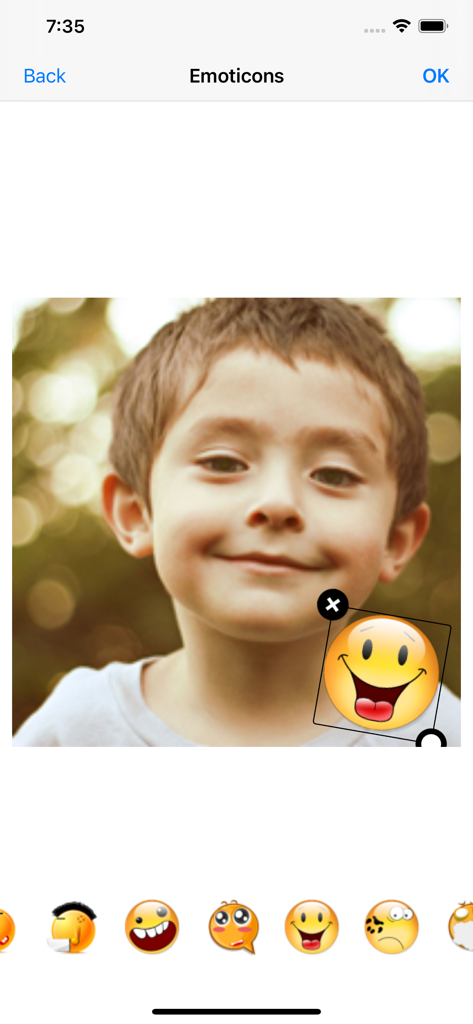 Aviary: Photo Editor, Airbrush - Adding a smiley face emoticon sticker to a child's photo in the Aviary app interface