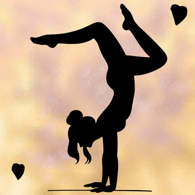 a woman doing a handstand